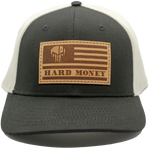 Black front, white mesh back. Light brown leather patch hat with dark brown accents of American flag with skull that reads "Hard Money"